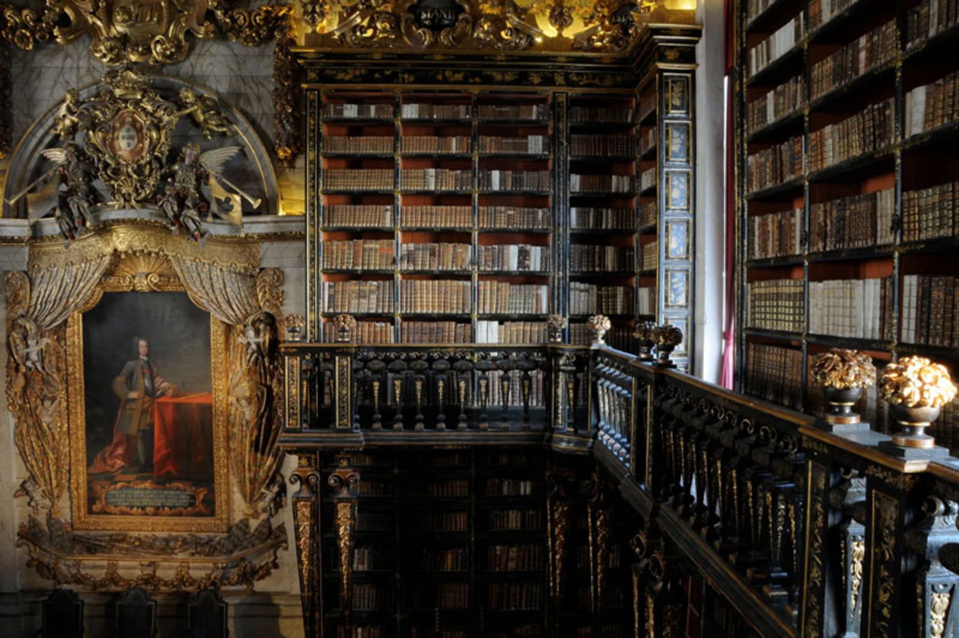 Baroque architecture and wooden shelves of the Joanina Library at the University of Coimbra, Portugal