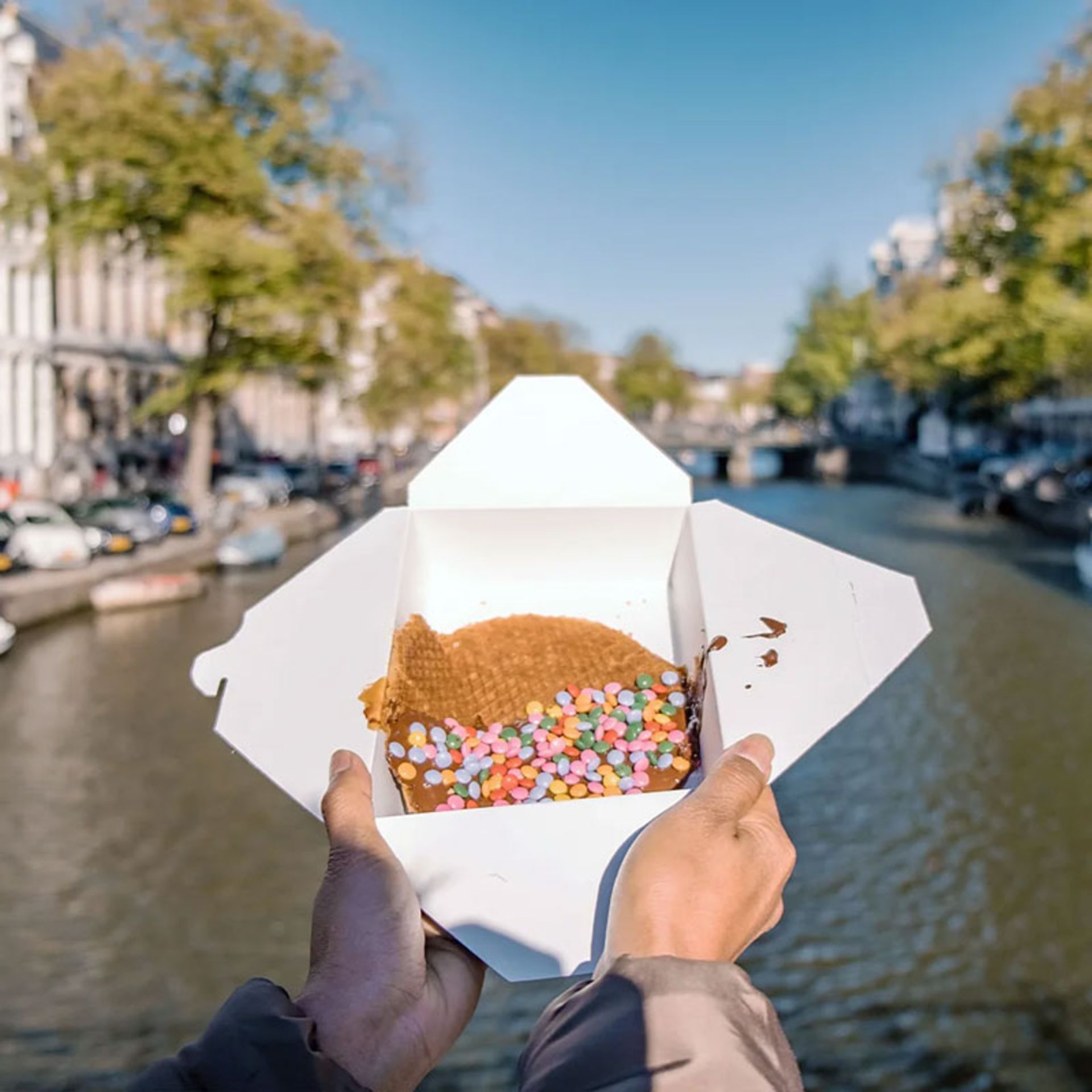 Waffles with colorful decorations on the canals of Amsterdam