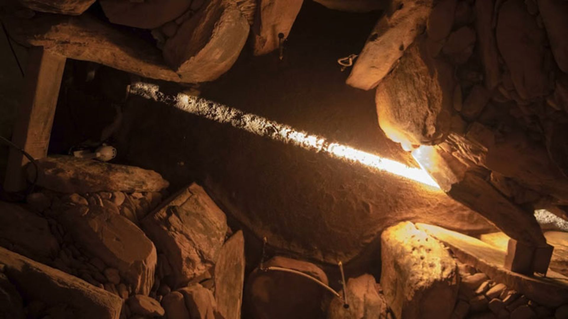 A ray of sunlight passing through a special window in the Newgrange tomb