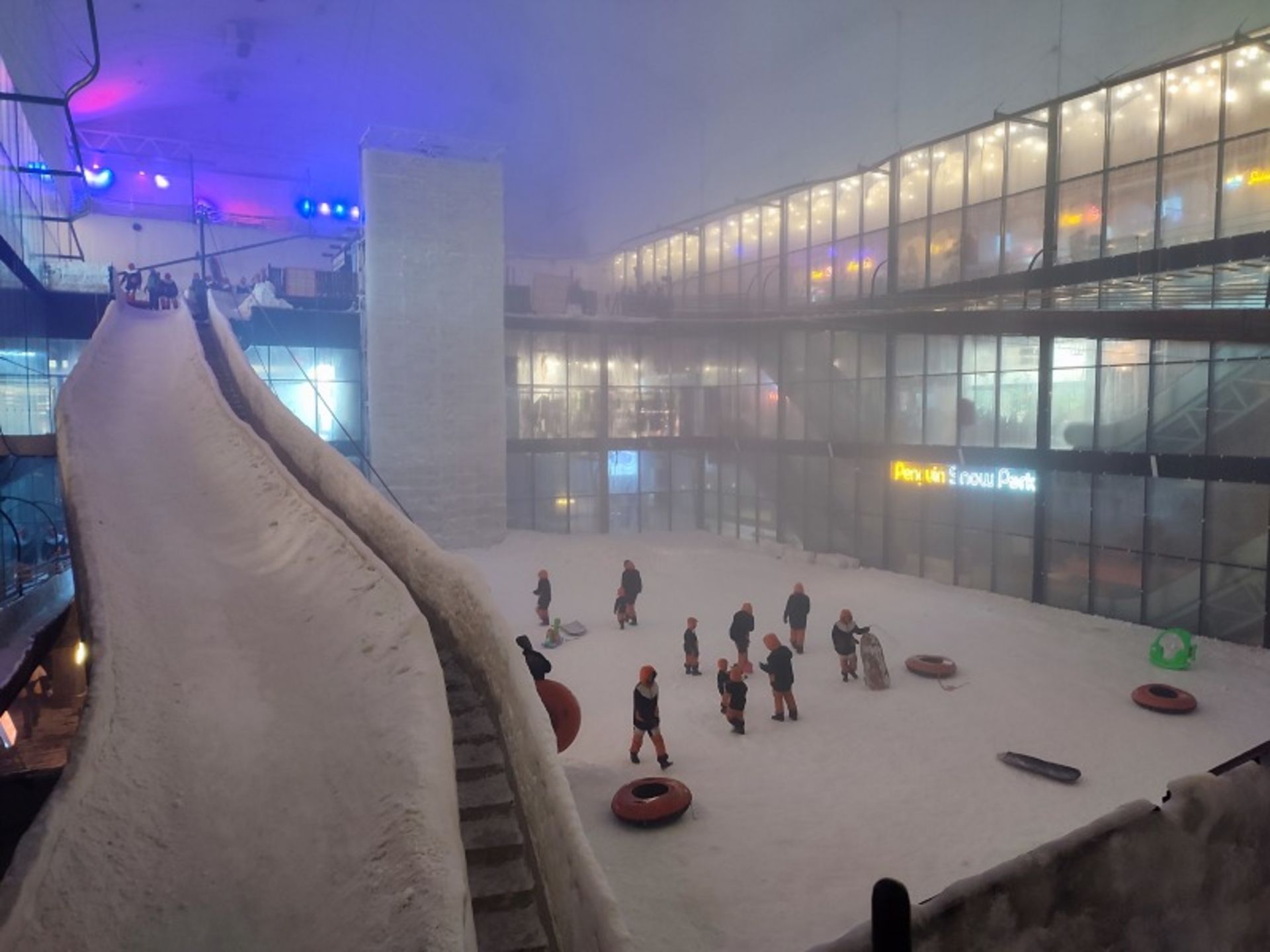 Tourists in special clothes in the ierior of Kish Penguin Snow Park