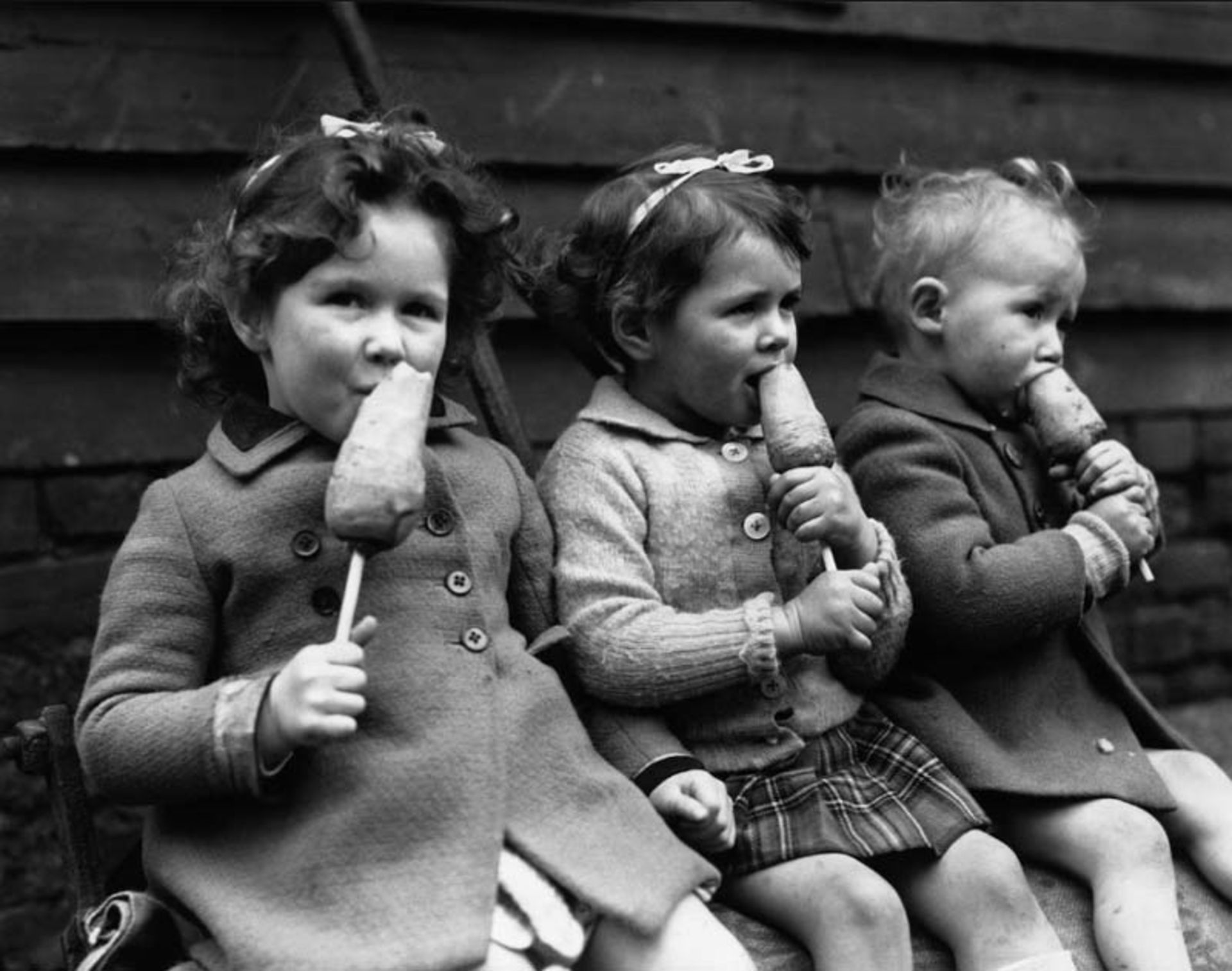 Children eating carrots as a healthy snack