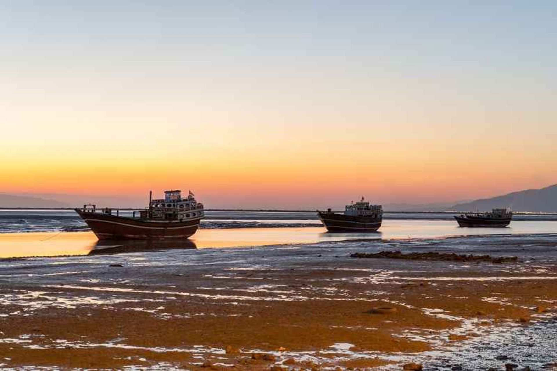 Large fishing barges in the waters around Loft Beach Park