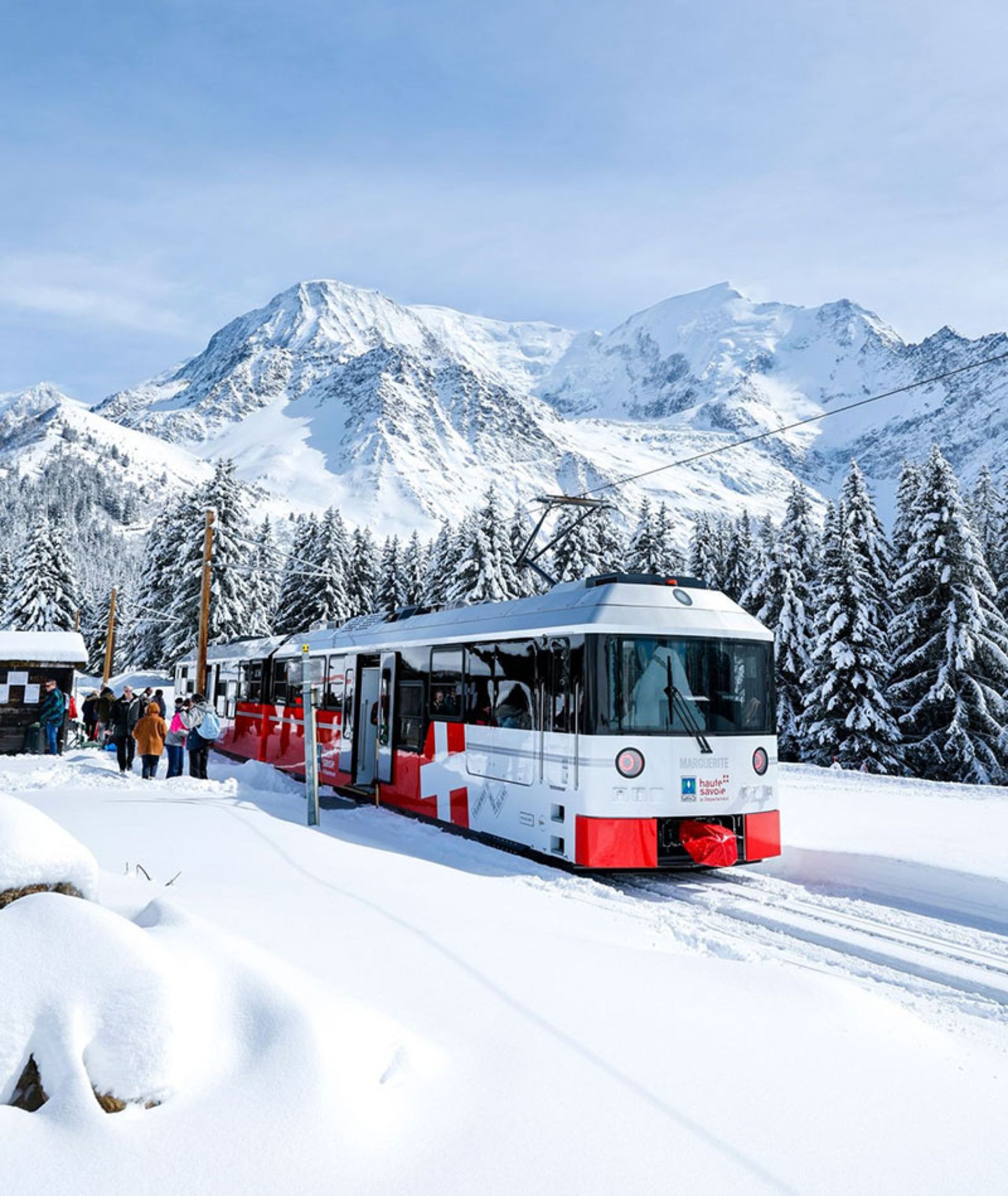 Train crossing the snowy and mouainous route in France