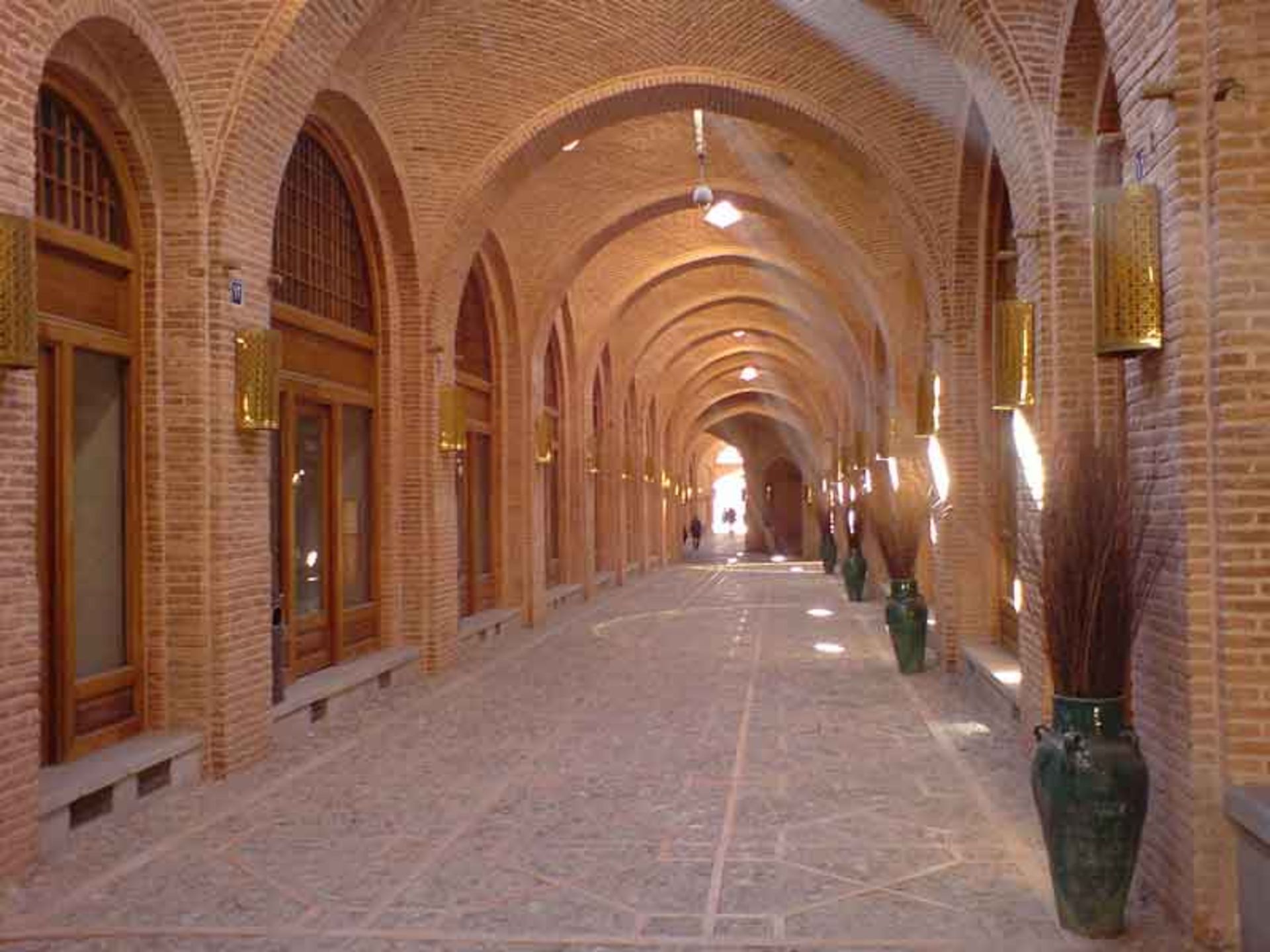 Corridor with brick walls and wooden doors in Saad al-Sultaneh Palace of Qazvin