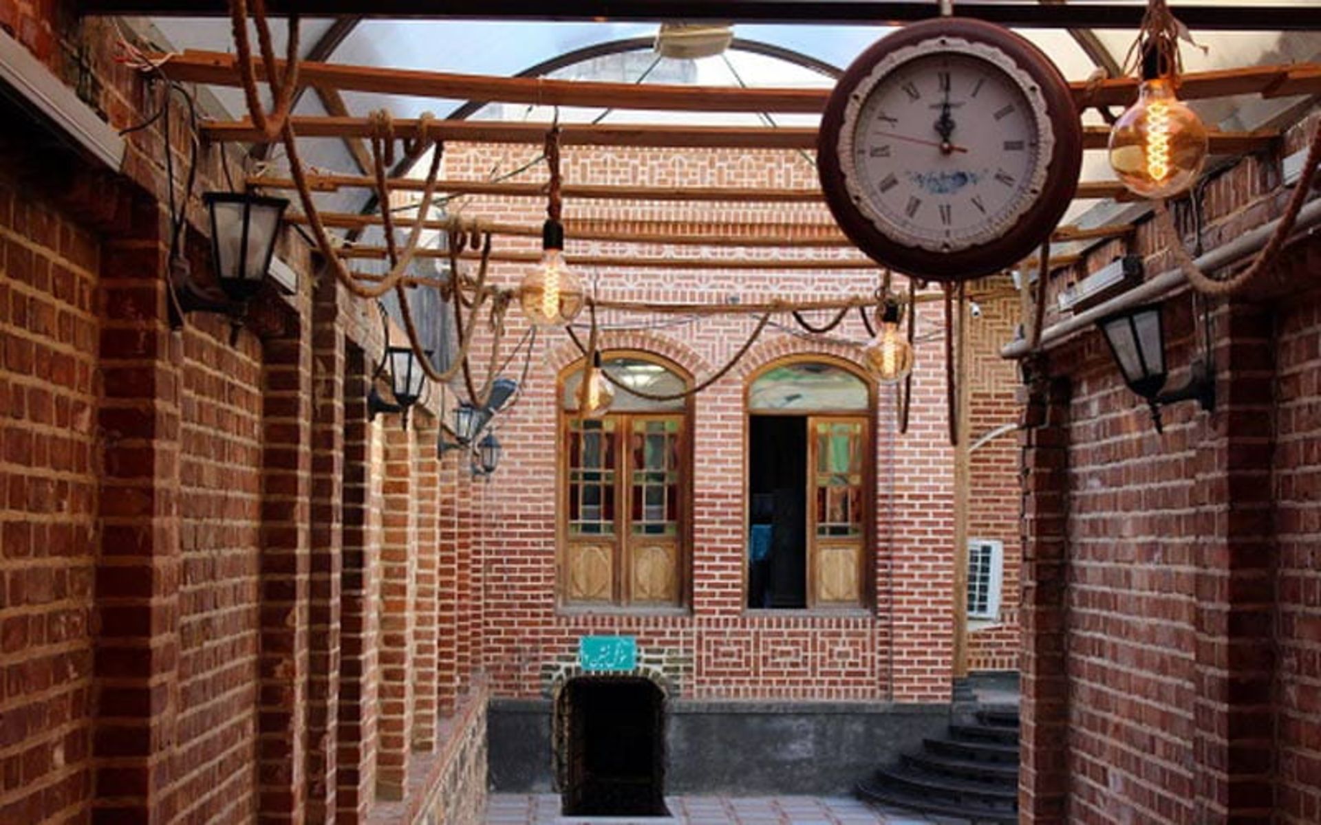 The clock inside the Aghazadeh mansion and the courtyard of the mansion