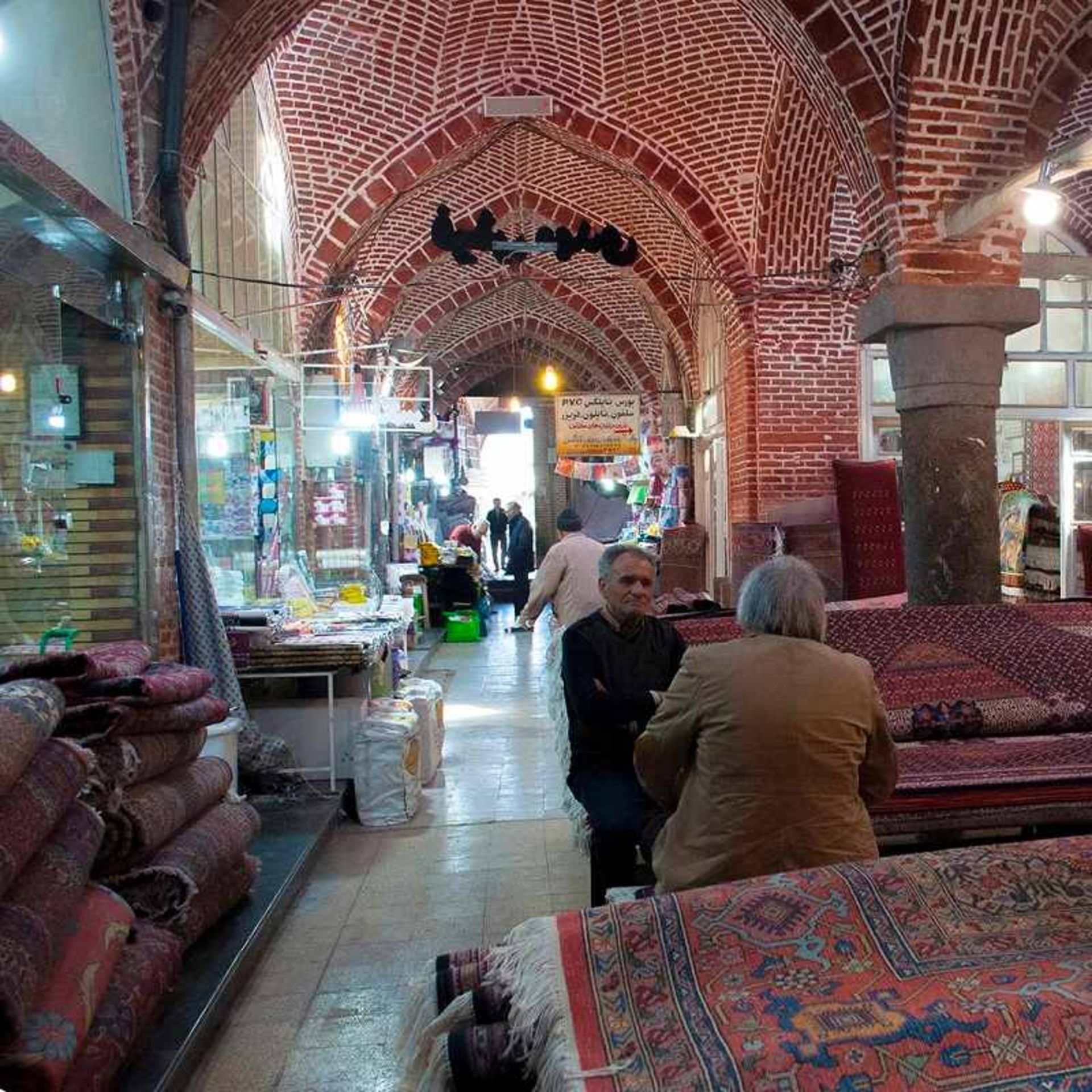 Hijra selling carpets in the historic market of Ardabil; Photo source: Google Map; Photographer: Ali Abazari