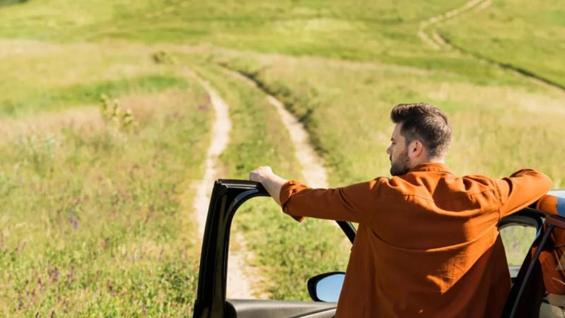 A man watching a dirt road in Dasht Sabz